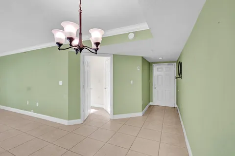 a view of a room with a mirror and fan