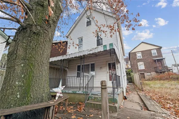 a front view of a house with a porch