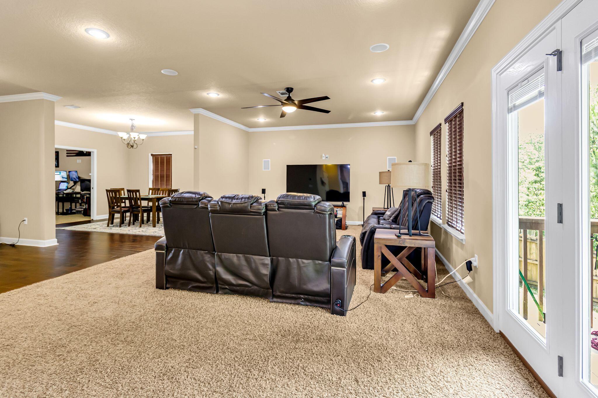 4558 Hermosa Road Crestview, FL 32539 - Photo 13 of 50 a living room with furniture and a flat screen tv