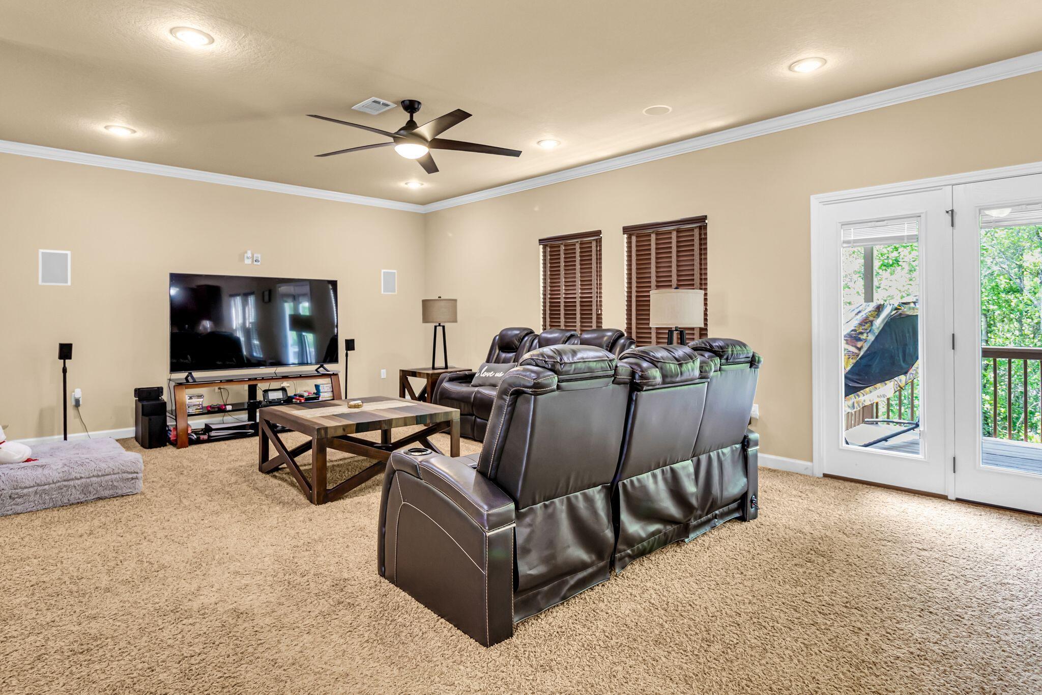 4558 Hermosa Road Crestview, FL 32539 - Photo 14 of 50 a living room with furniture and a flat screen tv
