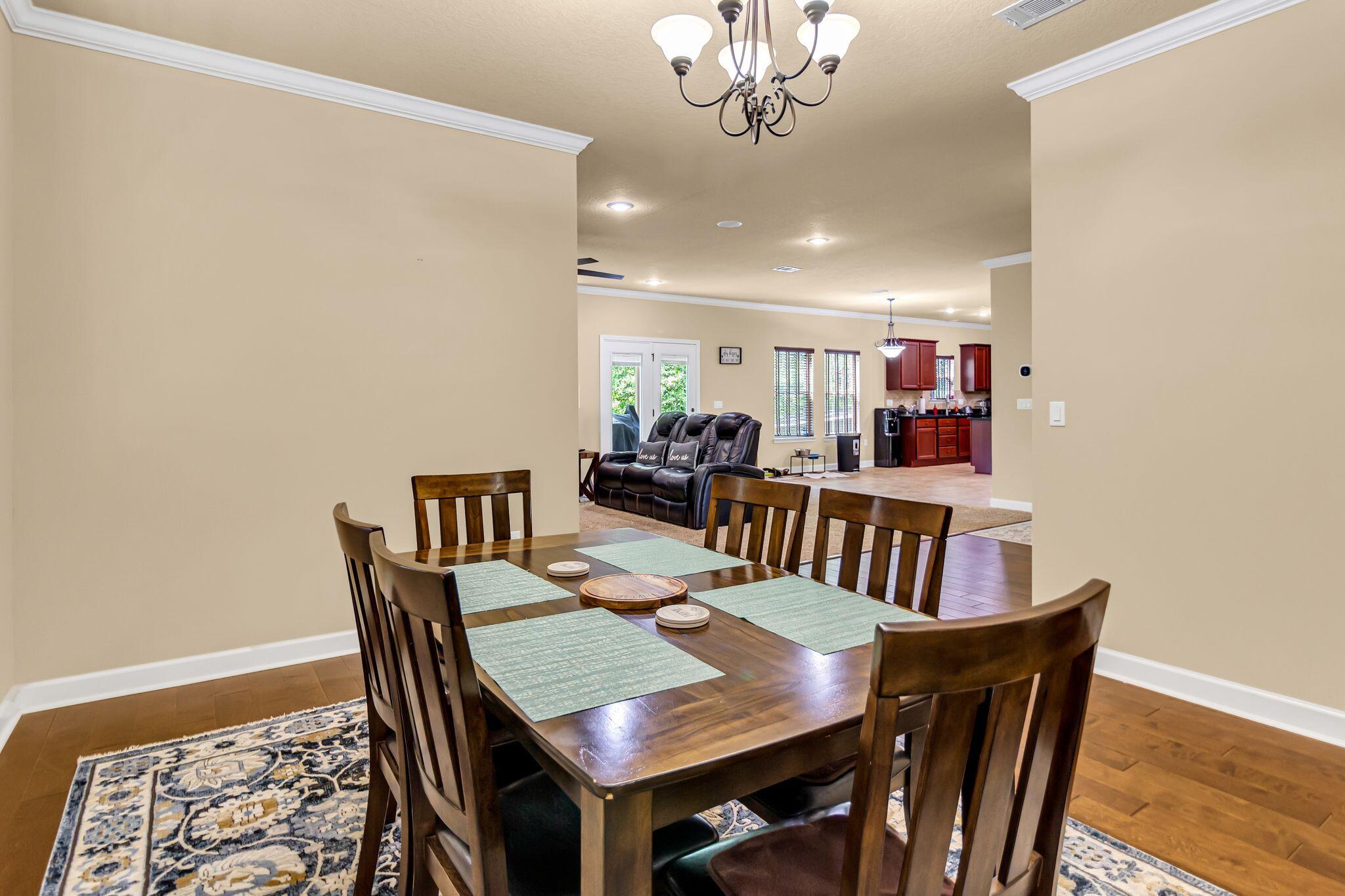 4558 Hermosa Road Crestview, FL 32539 - Photo 21 of 50 a view of a dining room with furniture
