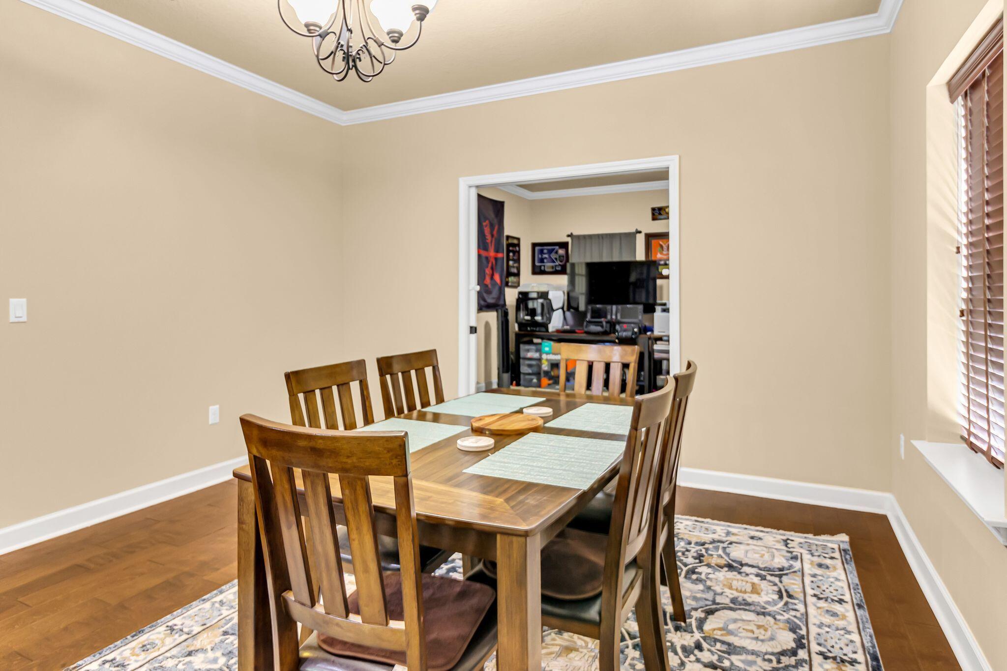 4558 Hermosa Road Crestview, FL 32539 - Photo 22 of 50 a dining room with furniture and window