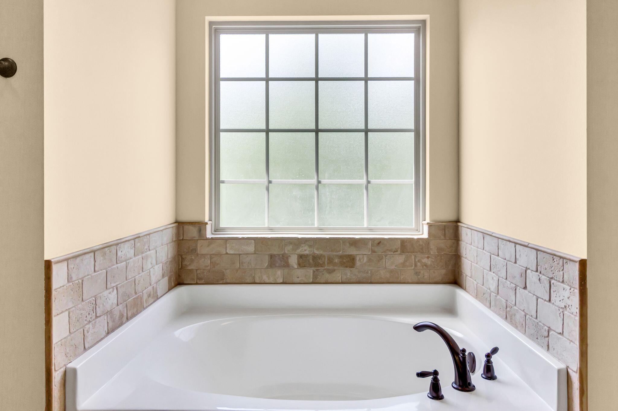 4558 Hermosa Road Crestview, FL 32539 - Photo 29 of 50 a bathroom with a bathtub