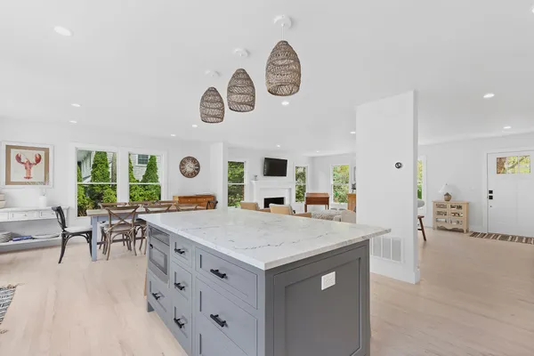 a kitchen with a table and chairs