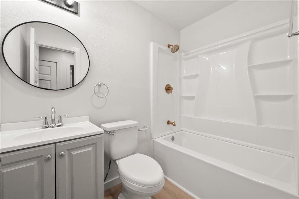 901 South 3rd Dawson, TX 76639 - Photo 14 of 32 a bathroom with a sink toilet and shower