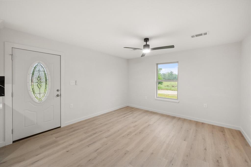 901 South 3rd Dawson, TX 76639 - Photo 2 of 32 an empty room with windows and closet