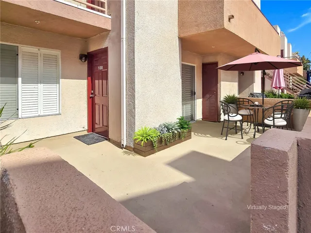 a view of a house with patio and a yard