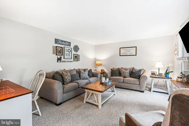 a living room with furniture and a couch