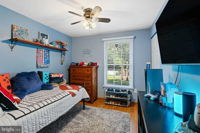 a bedroom with furniture and a window