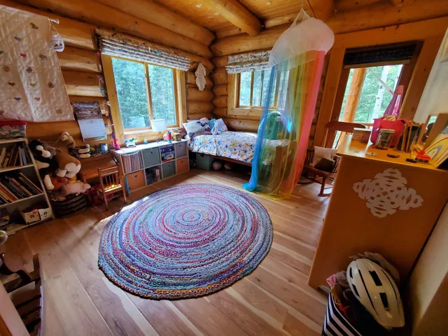 a room with furniture and a large window