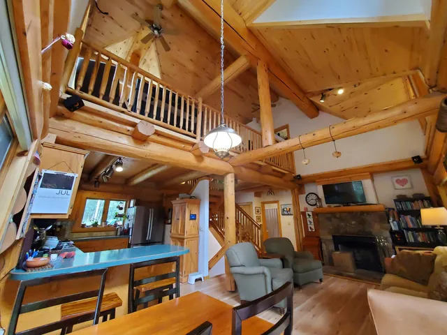 a view of living room kitchen and dining room