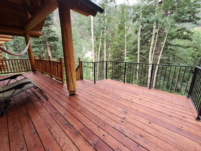 a balcony with wooden floor