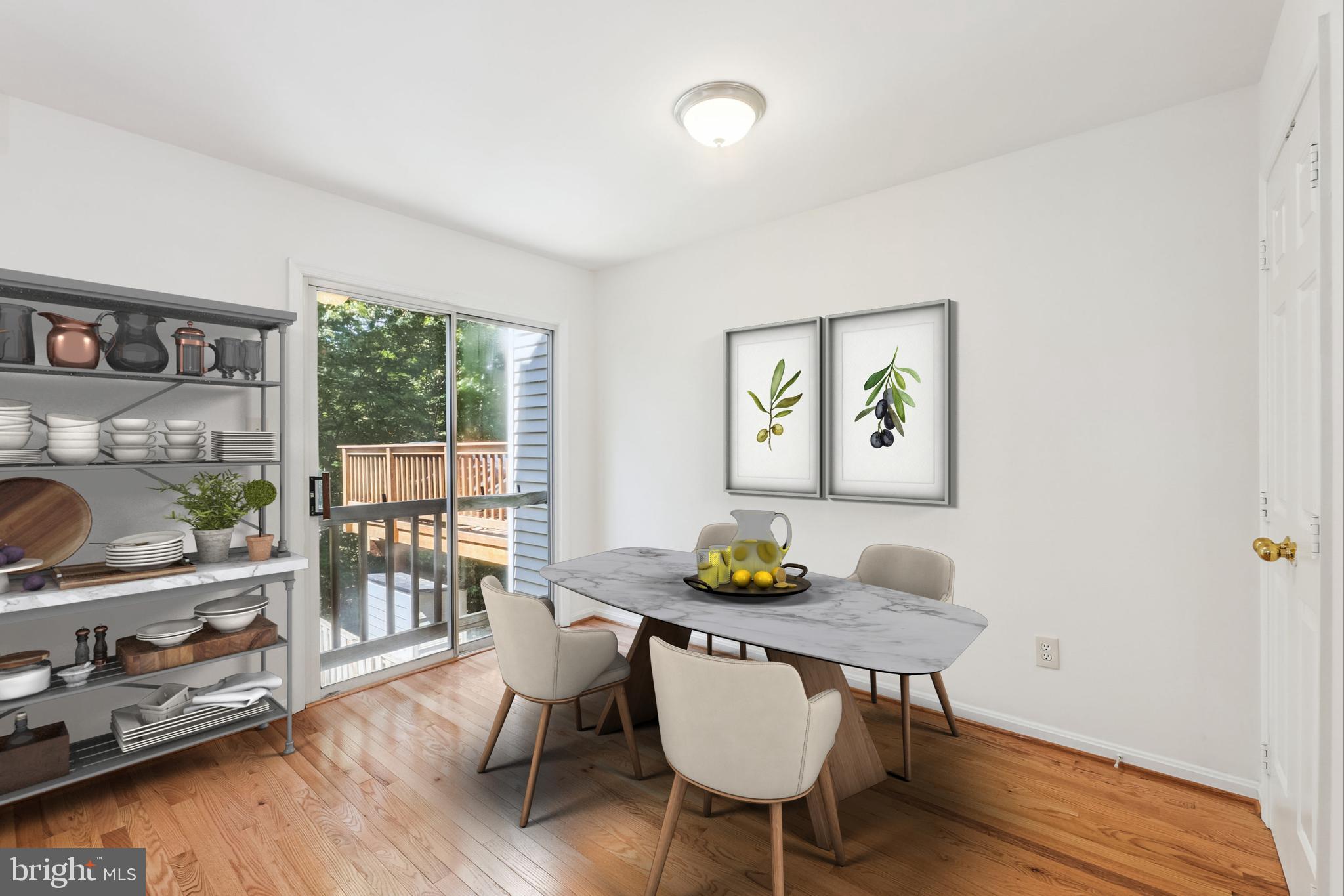 8840 Eagle Rock Lane Springfield, VA 22153 - Photo 16 of 52 a dining room with furniture a window and wooden floor