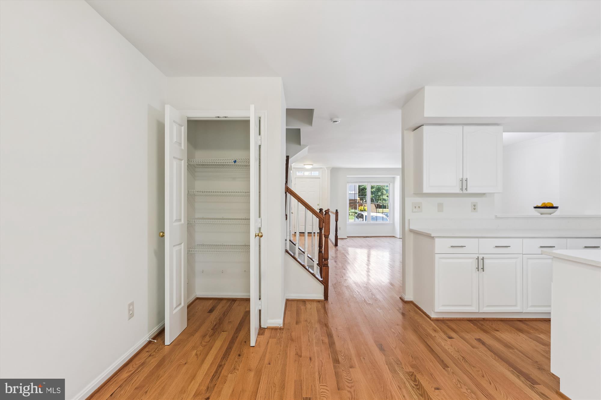 8840 Eagle Rock Lane Springfield, VA 22153 - Photo 18 of 52 a hallway with wooden floor and windows