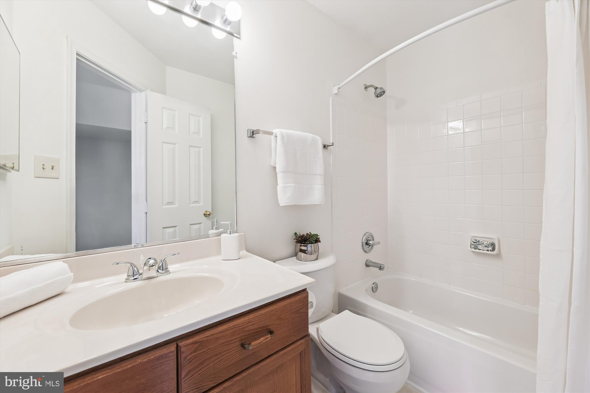 8840 Eagle Rock Lane Springfield, VA 22153 - Photo 20 of 52 a bathroom with a sink a toilet and shower