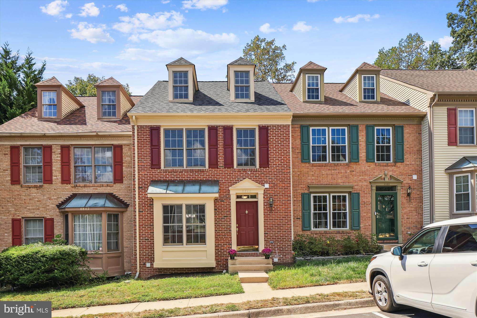 8840 Eagle Rock Lane Springfield, VA 22153 - Photo 2 of 52 a front view of a house with a yard