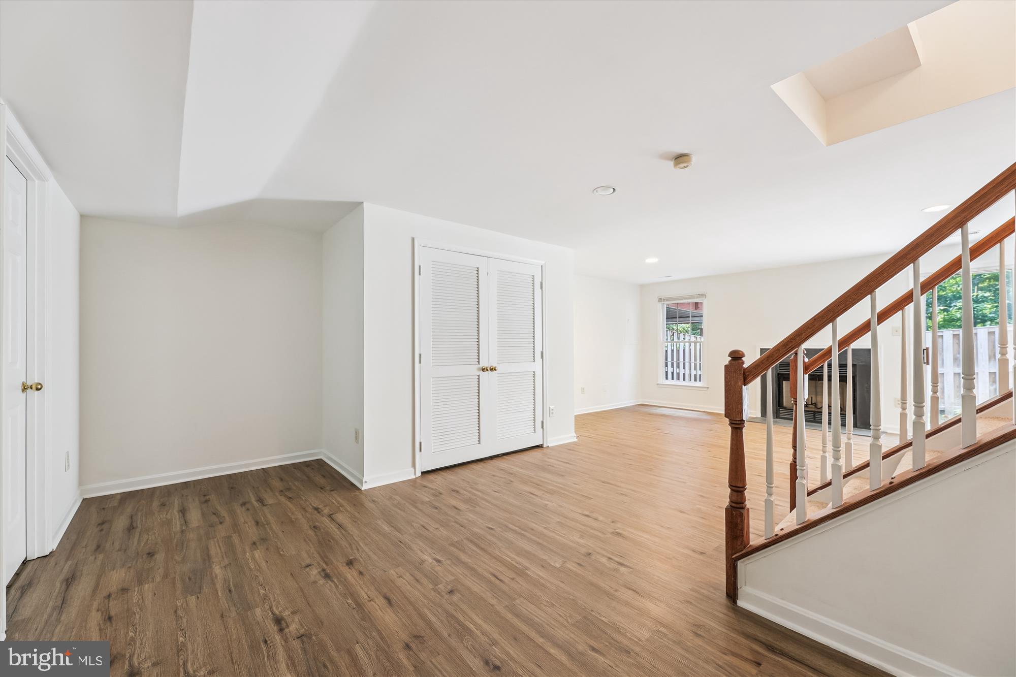 8840 Eagle Rock Lane Springfield, VA 22153 - Photo 40 of 52 a view of an empty room with wooden floor