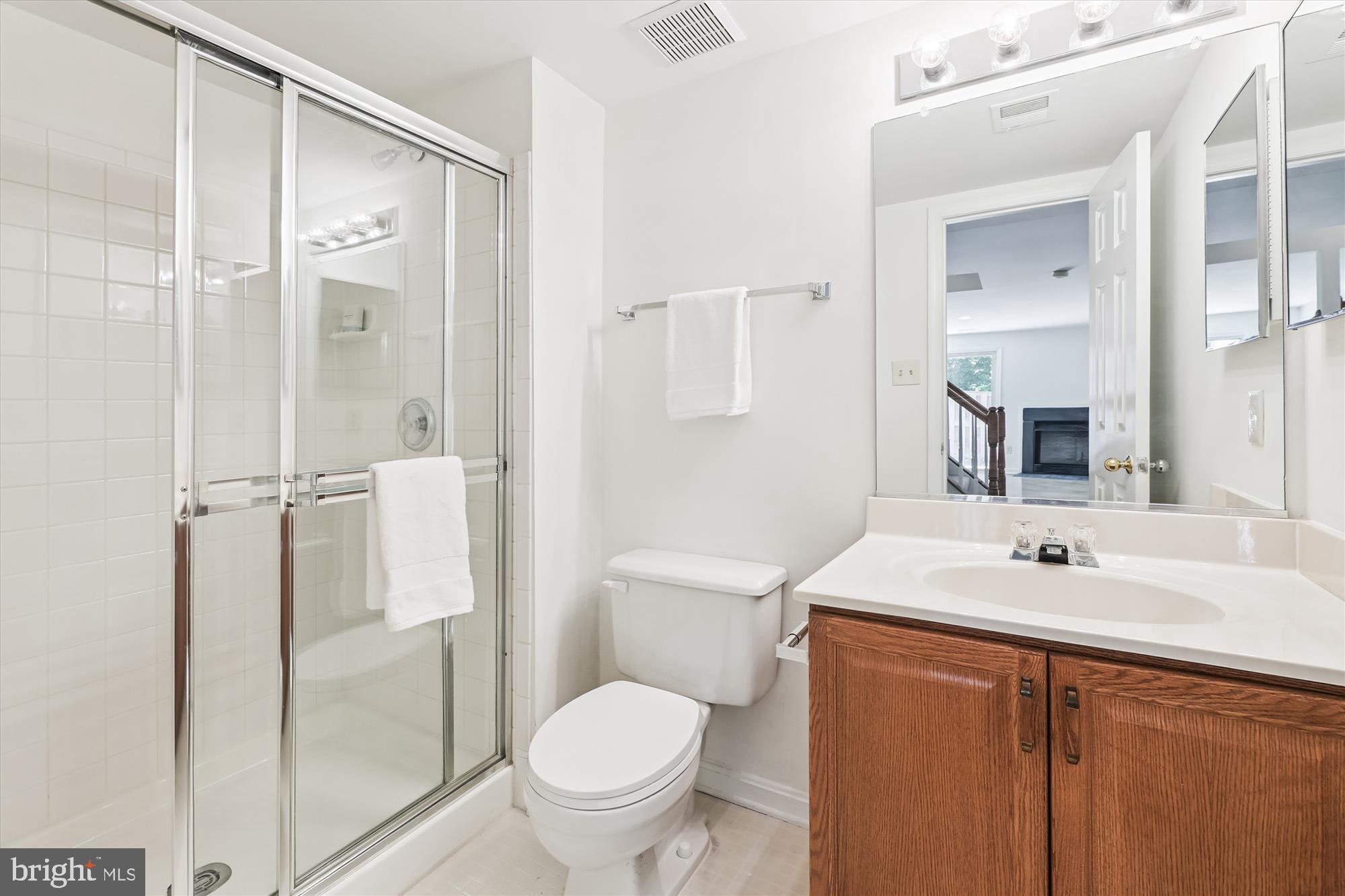 8840 Eagle Rock Lane Springfield, VA 22153 - Photo 42 of 52 a bathroom with a sink toilet and shower