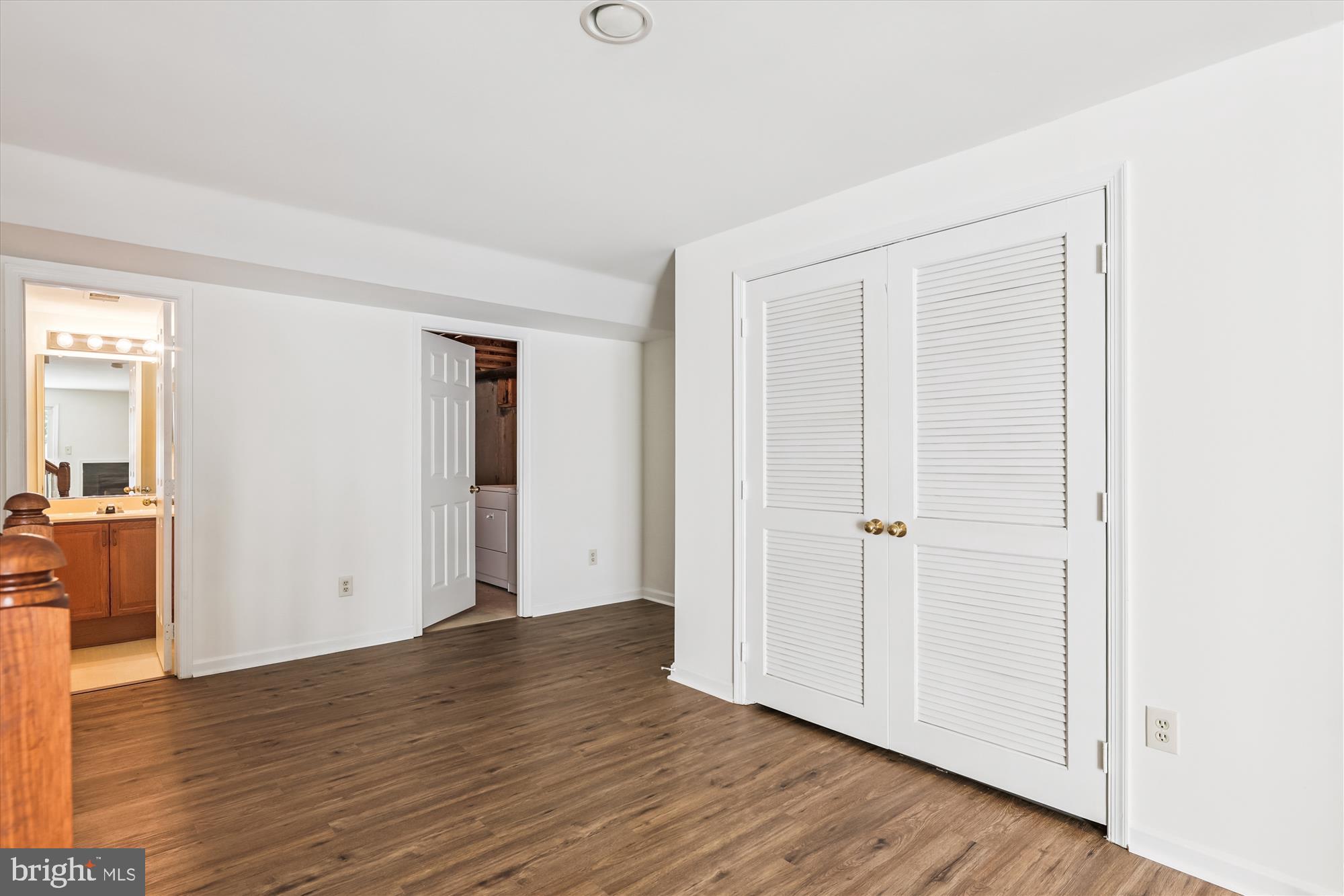 8840 Eagle Rock Lane Springfield, VA 22153 - Photo 43 of 52 an empty room with wooden floor & windows