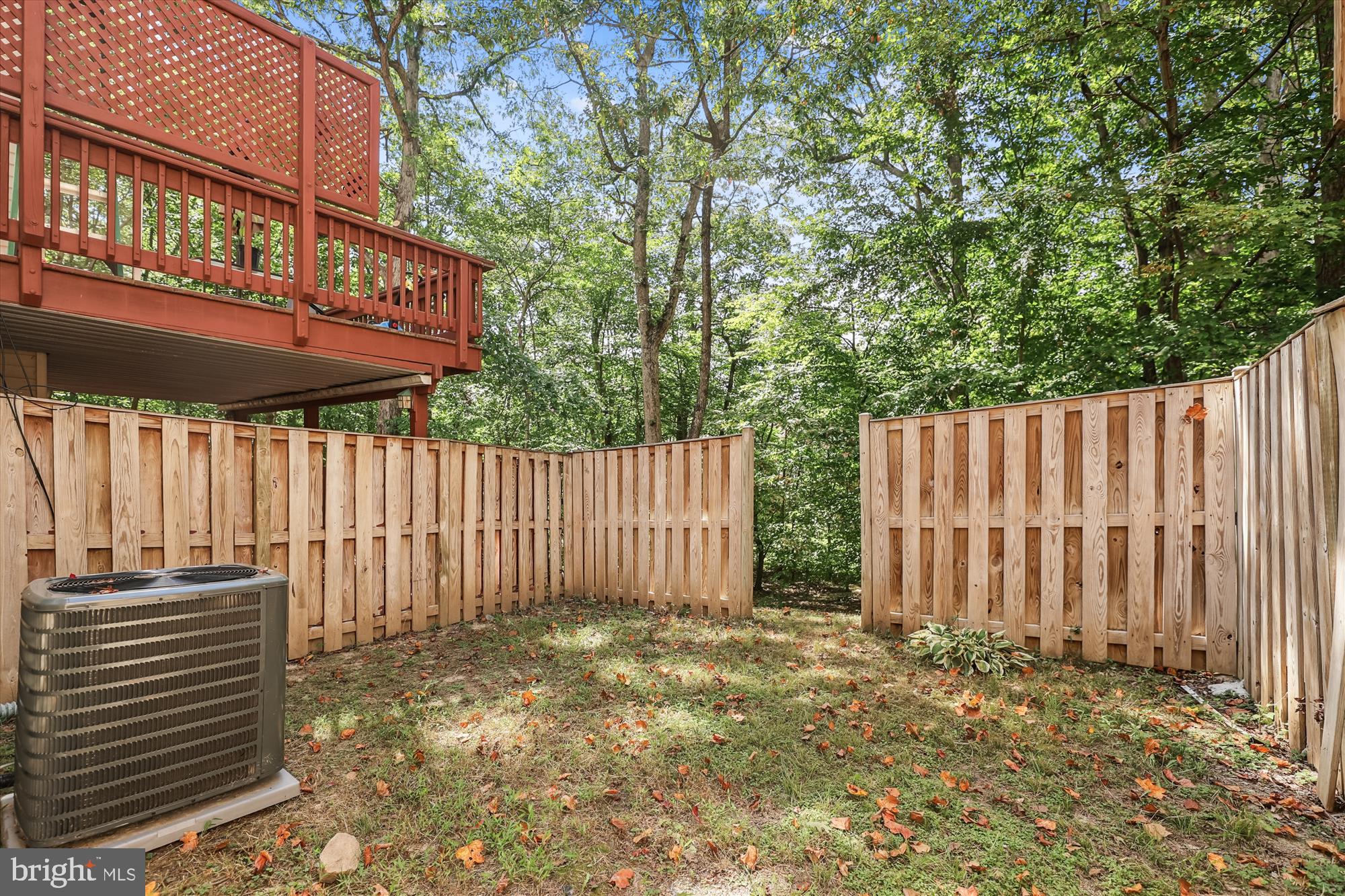 8840 Eagle Rock Lane Springfield, VA 22153 - Photo 45 of 52 a view of a house with a backyard and wooden fence
