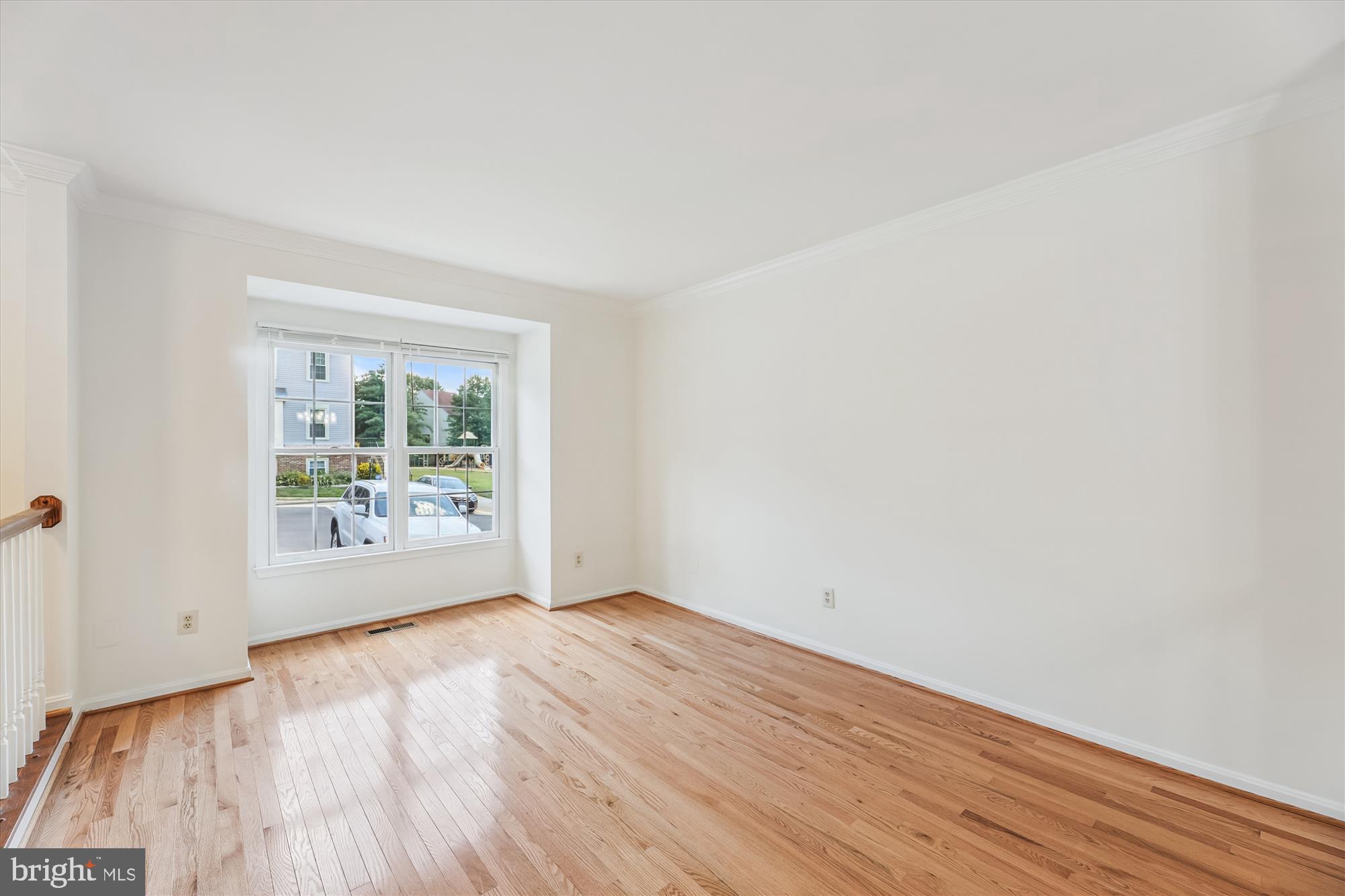 8840 Eagle Rock Lane Springfield, VA 22153 - Photo 6 of 52 an empty room with wooden floor and windows