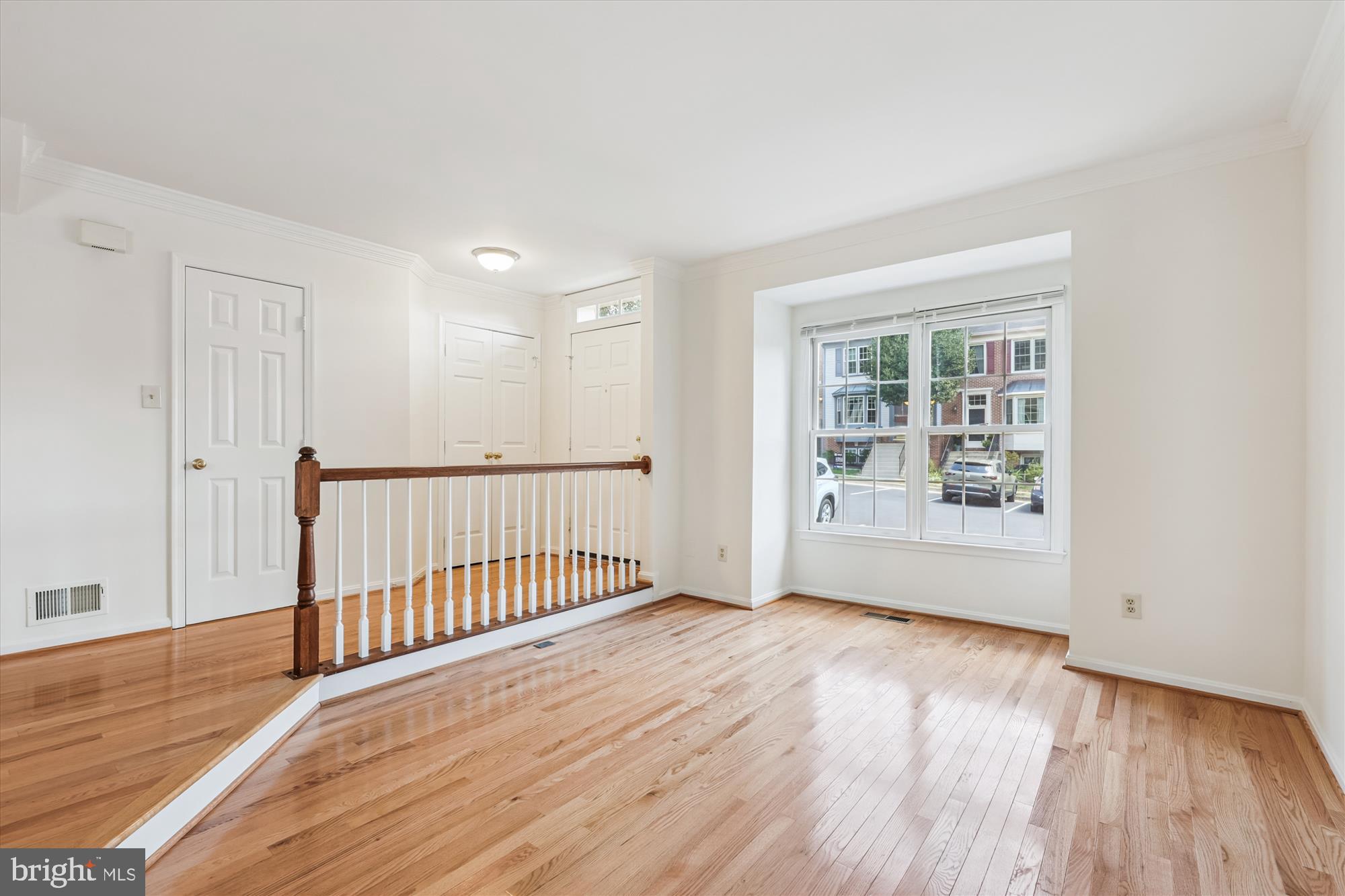 8840 Eagle Rock Lane Springfield, VA 22153 - Photo 7 of 52 a view of an empty room with wooden floor and a window