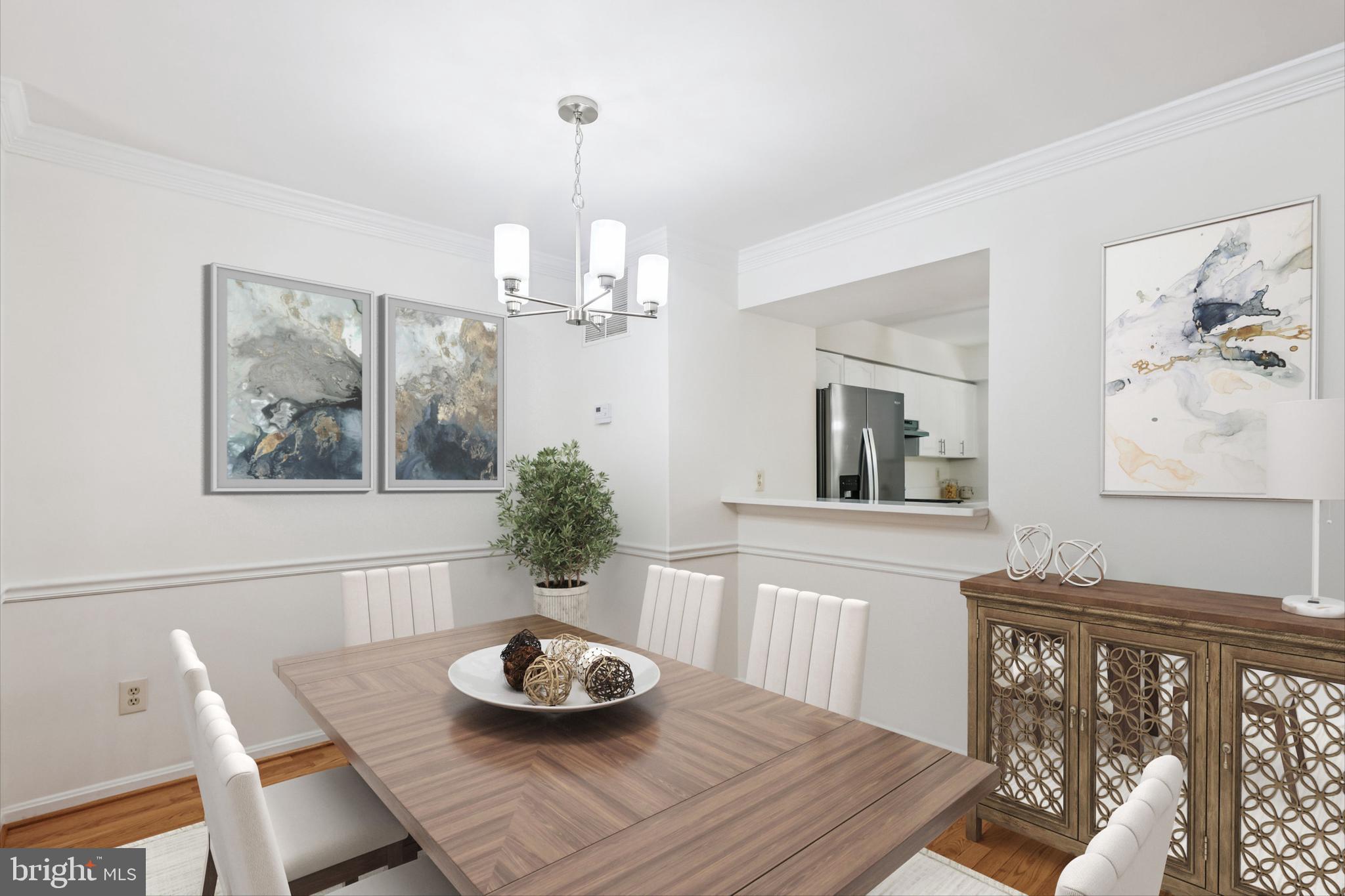 8840 Eagle Rock Lane Springfield, VA 22153 - Photo 10 of 52 a view of a dining room with furniture wooden floor and a chandelier