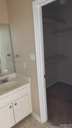 a bathroom with a sink and mirror