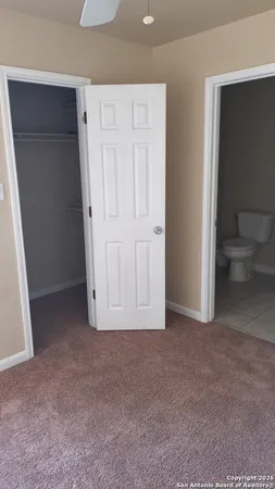 an empty room with a bathroom