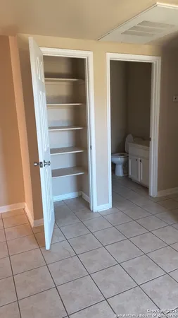 a view of closet area with empty racks