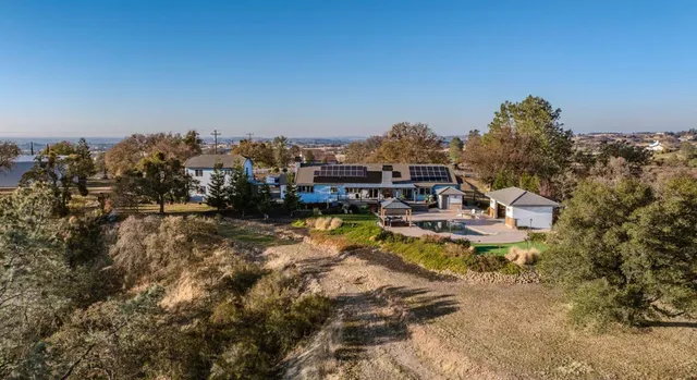 a view of a yard with an umbrella
