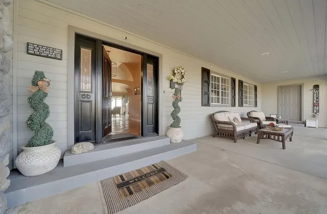 a bathroom with a sink mirror and toilet