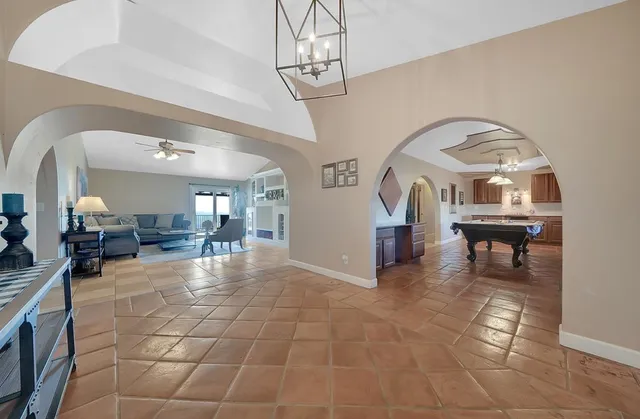 a spacious bathroom with a granite countertop sink a mirror and a