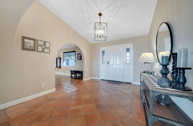 a spacious bathroom with a granite countertop sink a mirror and a