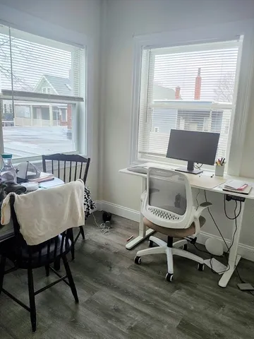 a workspace with furniture and a window