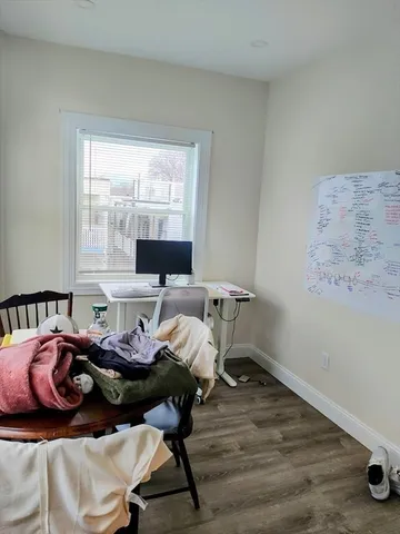 a bed room with furniture and a window
