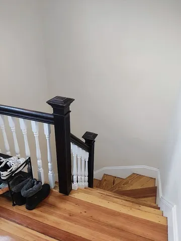 a bedroom with a bed and a mirror