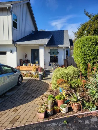 a view of backyard with cabin and wooden fencing