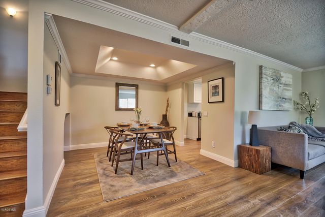 a view of a livingroom with furniture and wooden floor