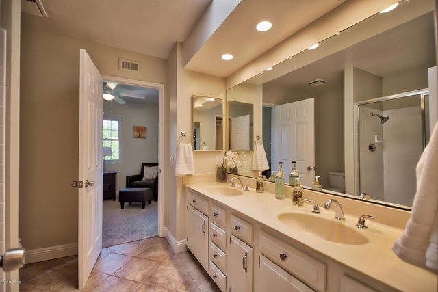 a spacious bathroom with a double vanity sink mirror and