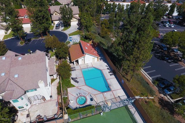 an aerial view of house with yard