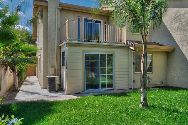 front view of a house with a garden