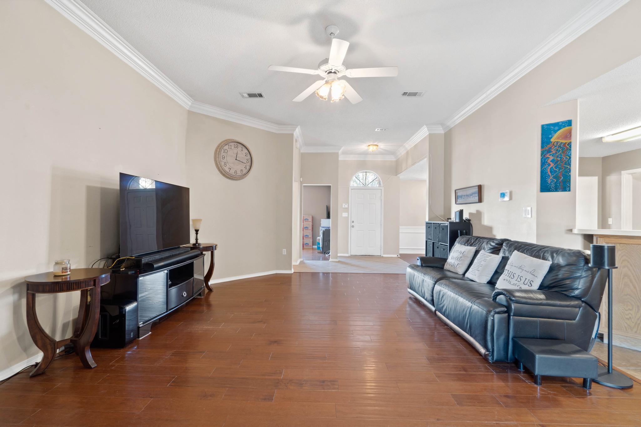 664 Brunson Street Crestview, FL 32536 - Photo 15 of 49 a living room with furniture and a flat screen tv