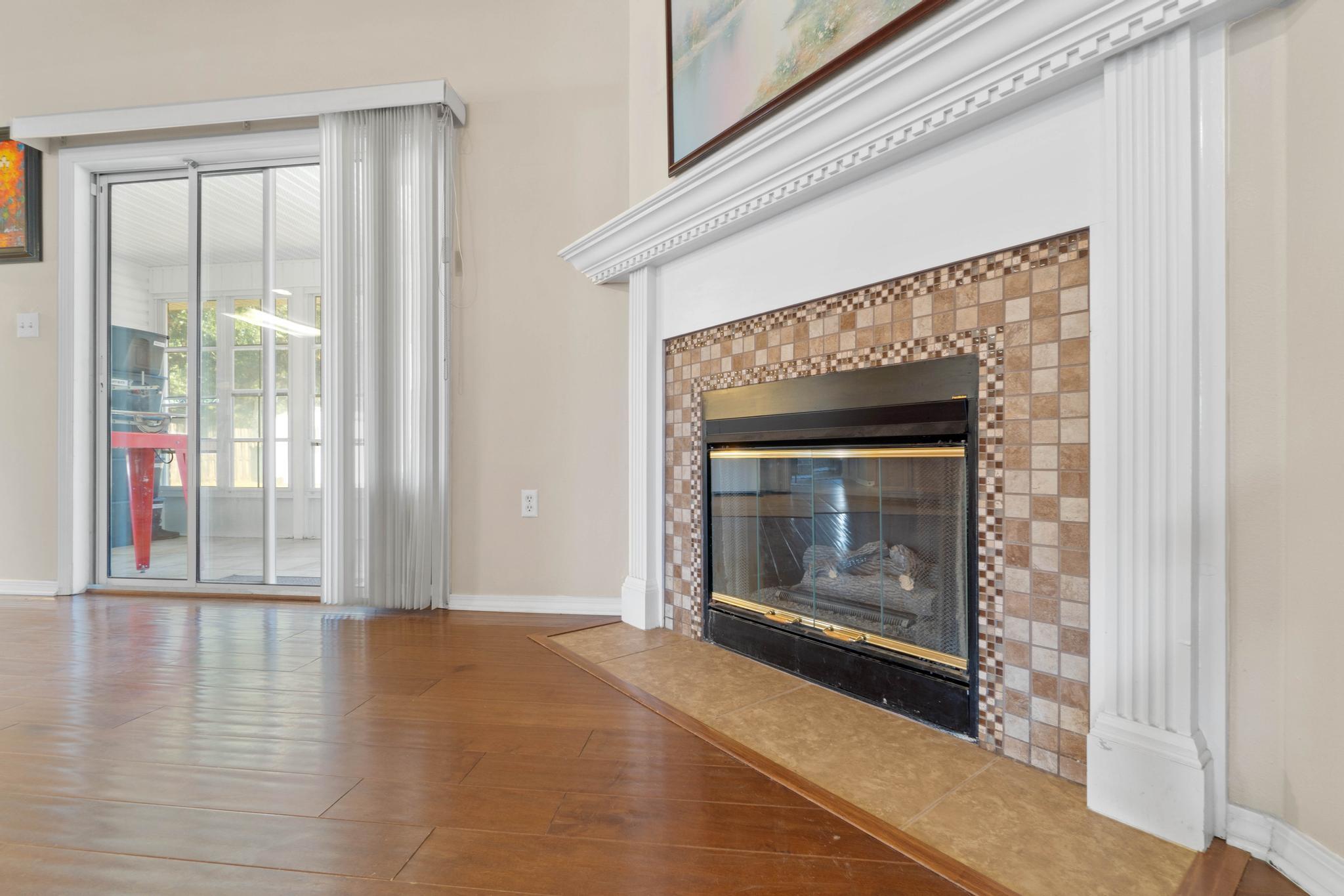 664 Brunson Street Crestview, FL 32536 - Photo 17 of 49 a view of an empty room with wooden floor and a window