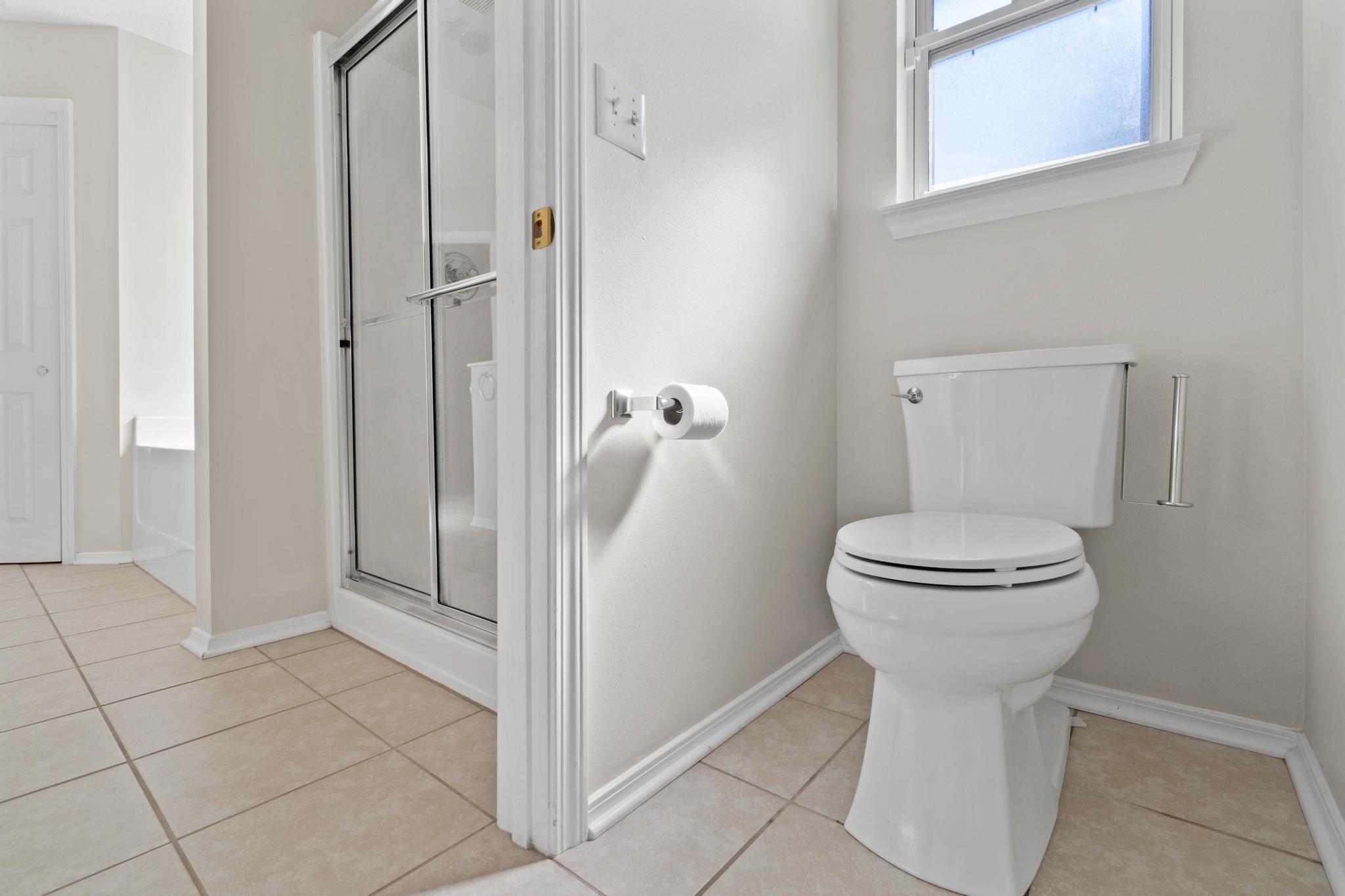 664 Brunson Street Crestview, FL 32536 - Photo 30 of 49 a bathroom with a toilet and a shower