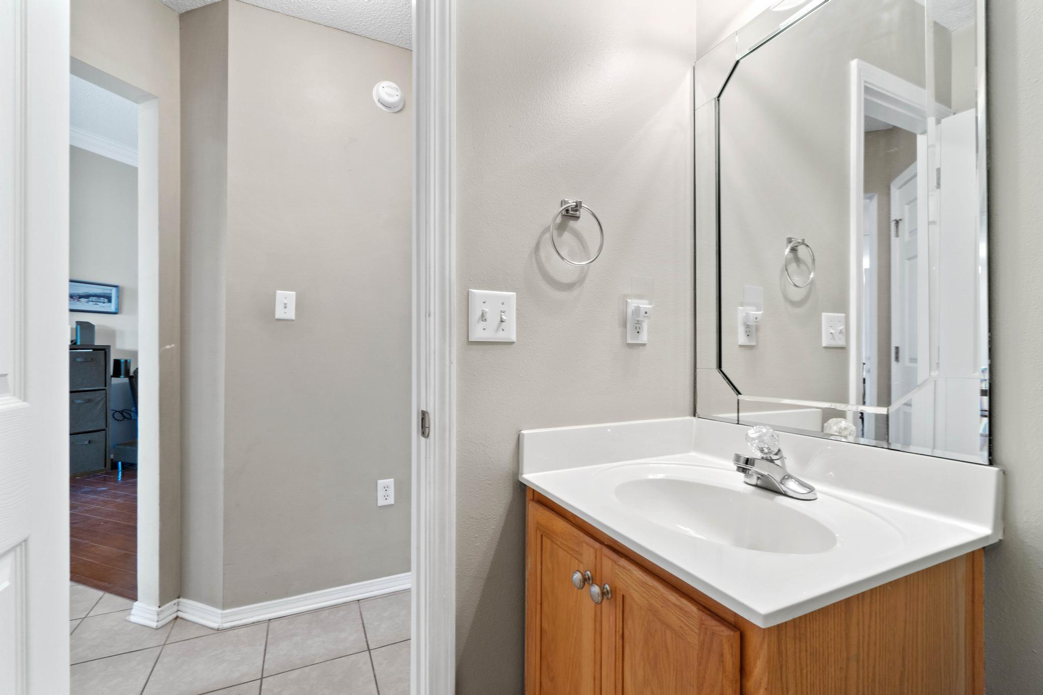 664 Brunson Street Crestview, FL 32536 - Photo 33 of 49 a bathroom with a sink and a mirror
