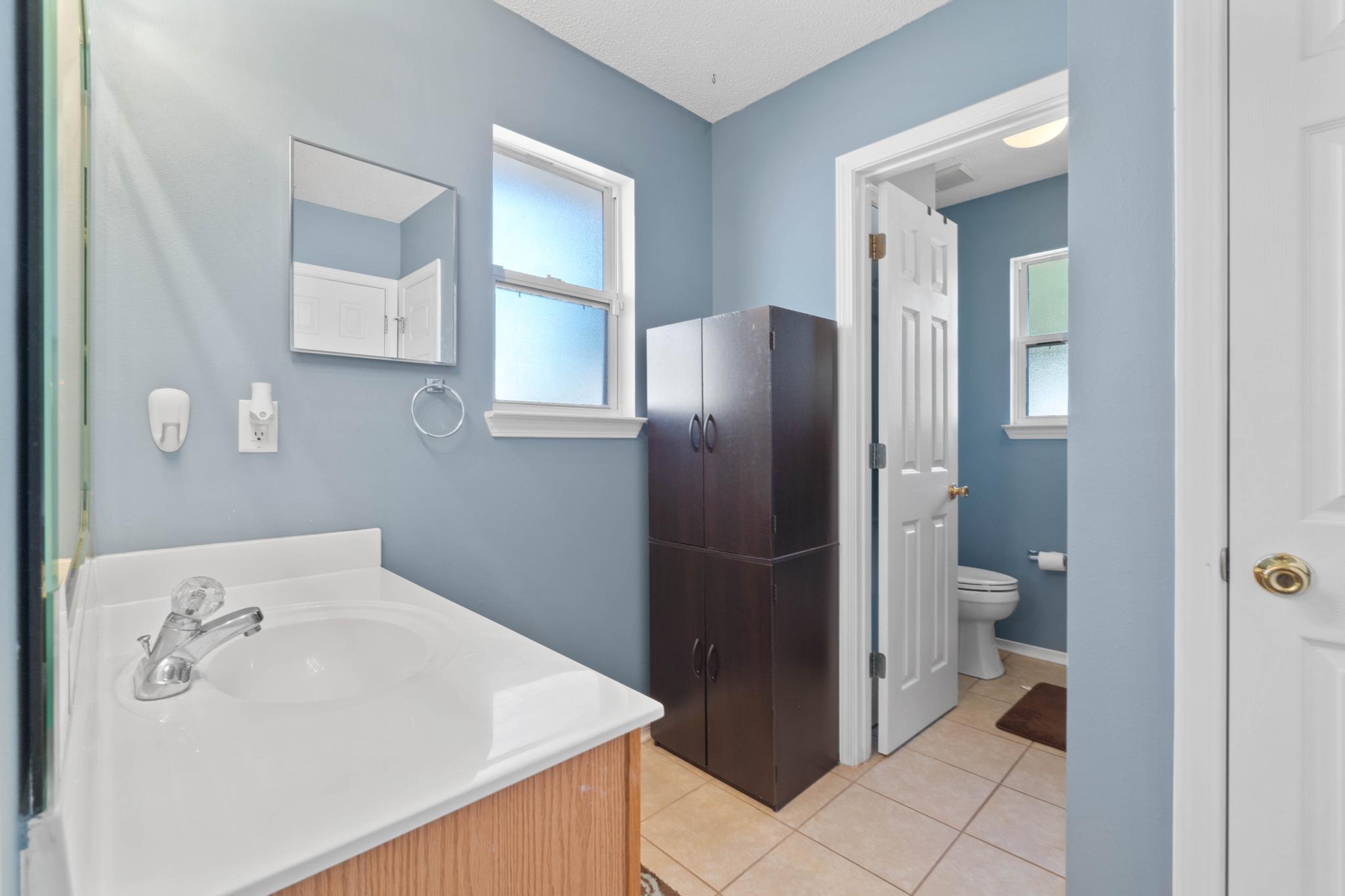 664 Brunson Street Crestview, FL 32536 - Photo 36 of 49 a bathroom with a sink and toilet