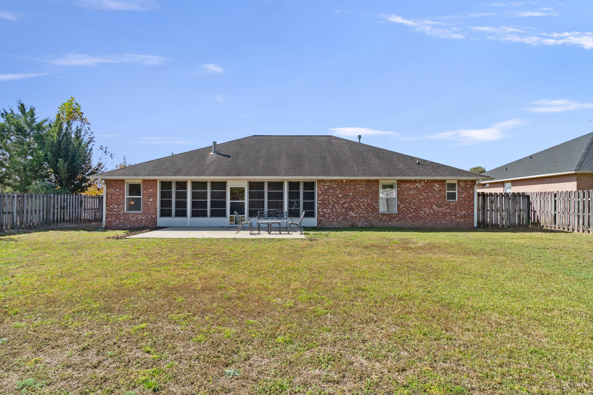664 Brunson Street Crestview, FL 32536 - Photo 44 of 49 a front view of a house with a garden