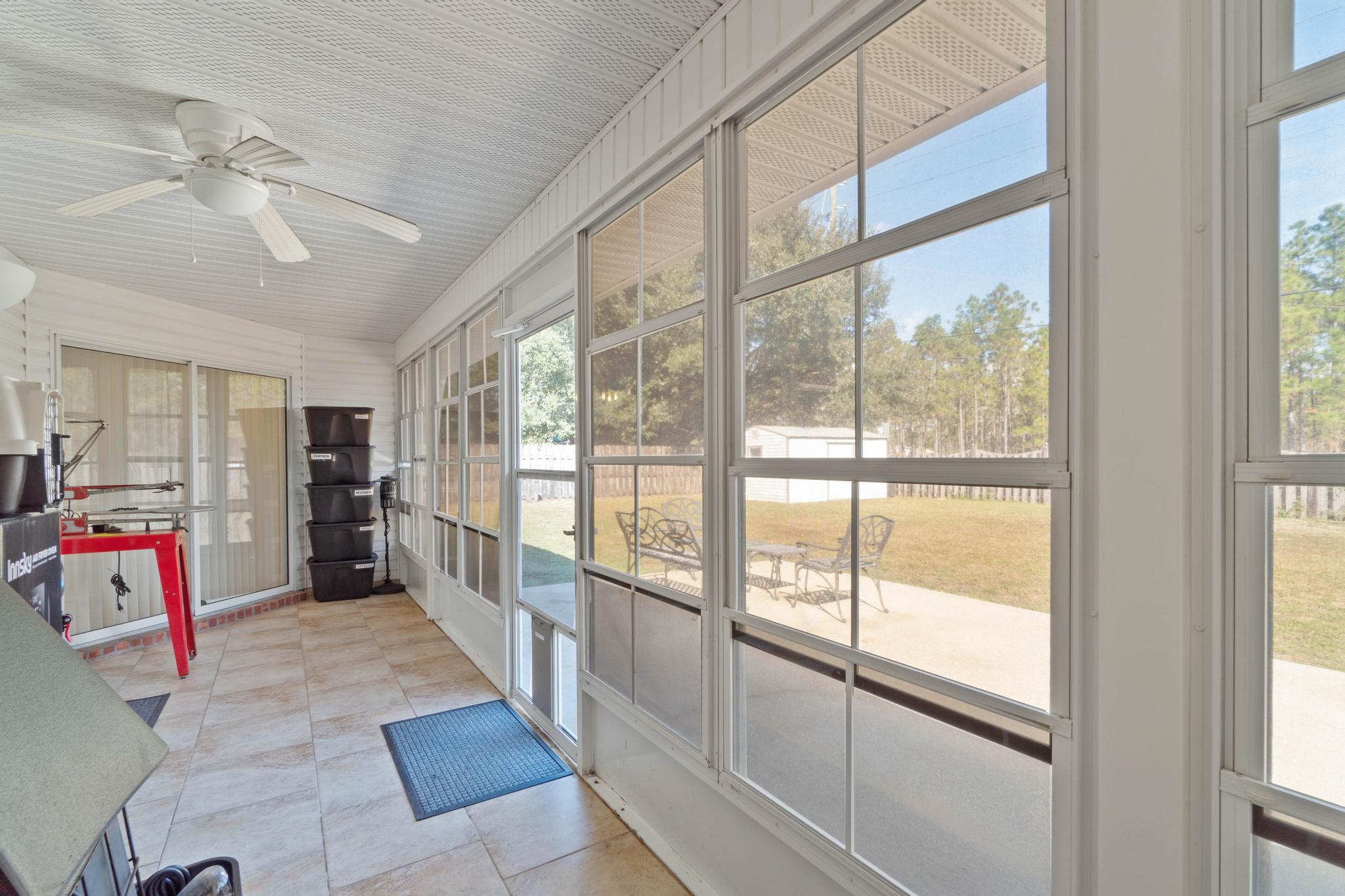 664 Brunson Street Crestview, FL 32536 - Photo 45 of 49 a view of a hallway with furniture and entryway