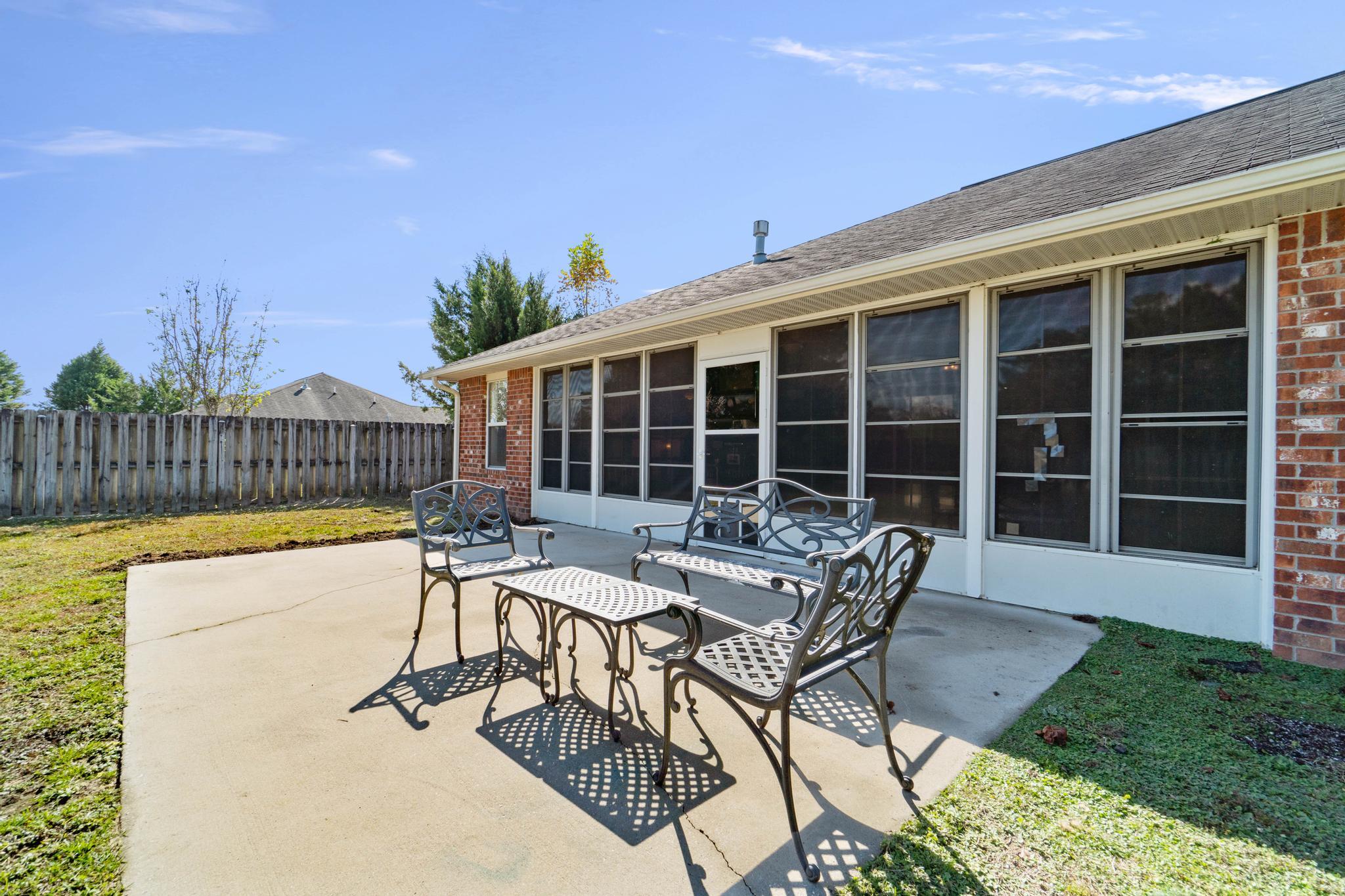 664 Brunson Street Crestview, FL 32536 - Photo 47 of 49 a view of a house with swimming pool and sitting area